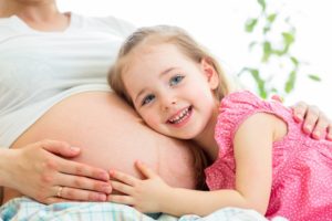 Surrogate, Happy,Kid,Girl,Hugging,Pregnant,Mother's,Belly